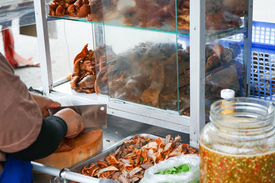 Man preparing food at store