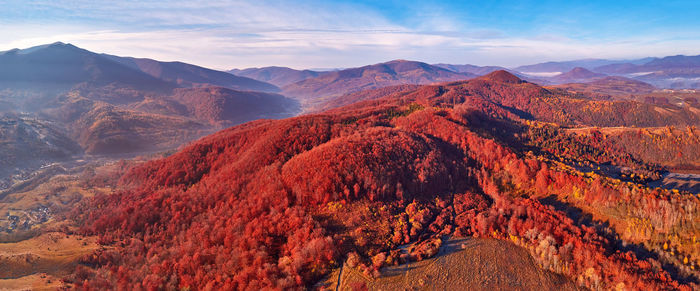 November mountain panorama. mountain autumn misty sunrise landscape. morning valley covered by fog 