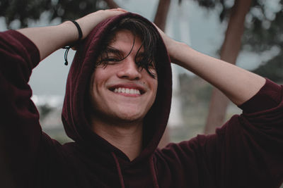 Portrait of young man standing outdoors