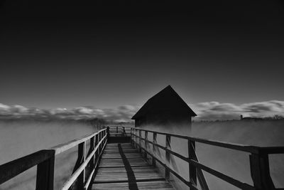 Pier over sea against sky