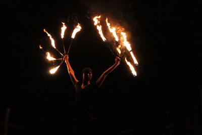 Midsection of man against illuminated clear sky at night