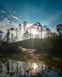 A fisherman was netting fish in the morning on the lake on 12 june 2021