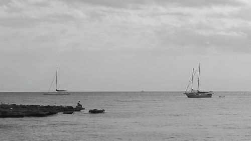 Sailboats sailing on sea