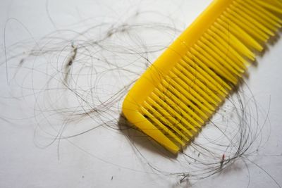 High angle view of yellow paper on table