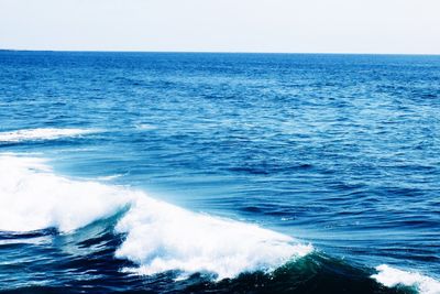 Scenic view of sea against blue sky