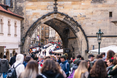 Group of people in front of building in city