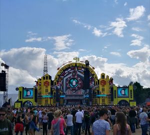 People at music concert against sky