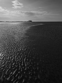 Surface level of beach against sky