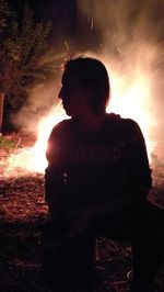 Silhouette man standing at night