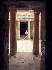 Full length of woman standing in historic building