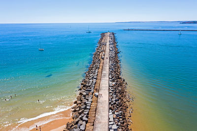 Top shot from breakwater at the entrance of portimao harbor in the netherlands