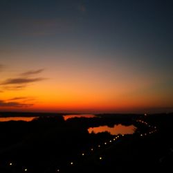 Scenic view of silhouette landscape against romantic sky at sunset