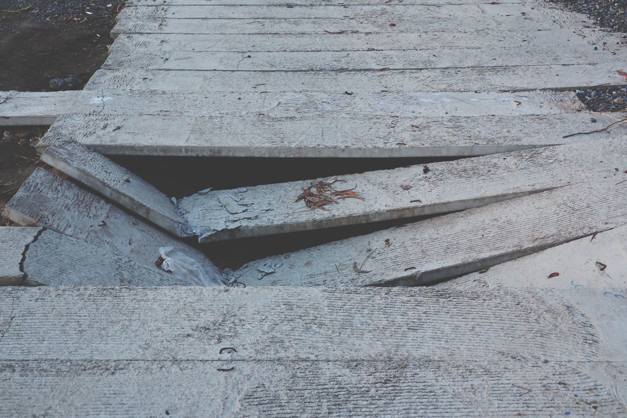 HIGH ANGLE VIEW OF OLD METAL STRUCTURE ON STEPS