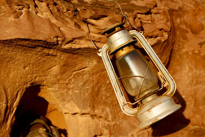 Low angle view of electric lamp on wall