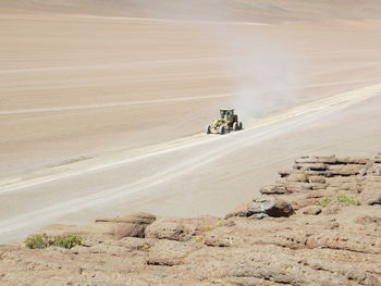 High angle view of vehicle on sand at desert