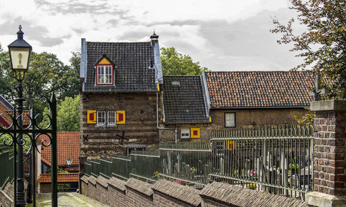 Houses and buildings against sky