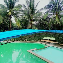 Swimming pool against calm blue sea