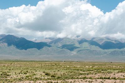 Scenic view of landscape and mountains against sky