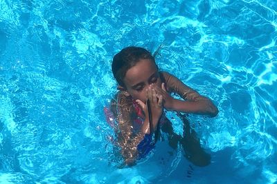 High angle view of girl in swimming pool