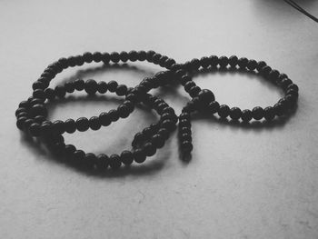 High angle view of bead necklace on table