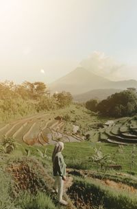 Scenic view of agricultural land against sky