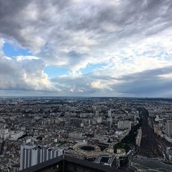 High angle view of cityscape against cloudy sky