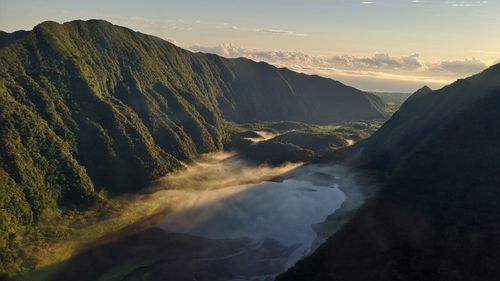 Scenic view of mountains against sky during sunset