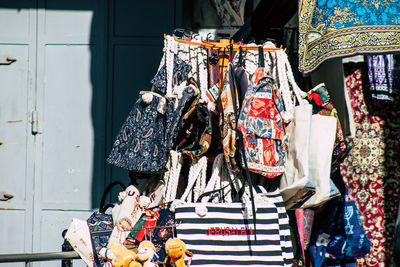 Clothes hanging for sale at market stall