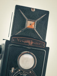 Low angle view of old telephone booth