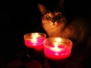 Close-up of illuminated tea light candle on table