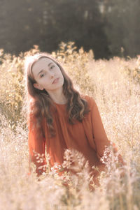 Portrait of beautiful young woman on land