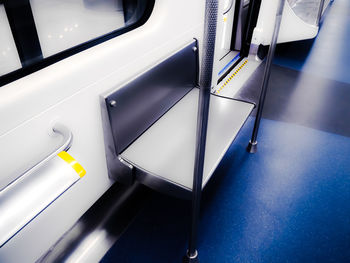 High angle view of empty seats in subway train