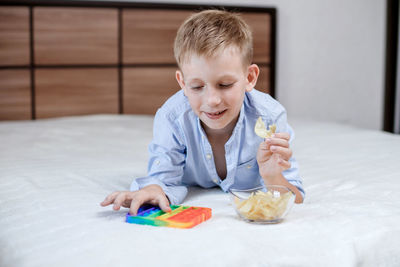 Portrait of boy eating food