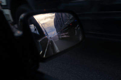 Reflection of car on side-view mirror