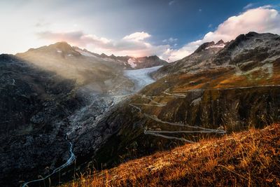 Scenic view of mountains against sky during sunset