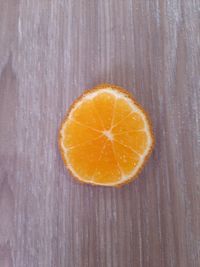 Close-up of orange slice on table