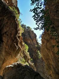 Low angle view of rock formation against sky