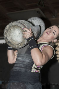 Woman from the basque country practicing stone lifting rural sport