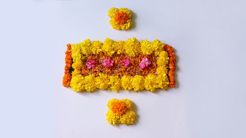 High angle view of multi colored pencils on white background