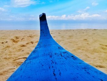 Close-up of sand on beach against sky