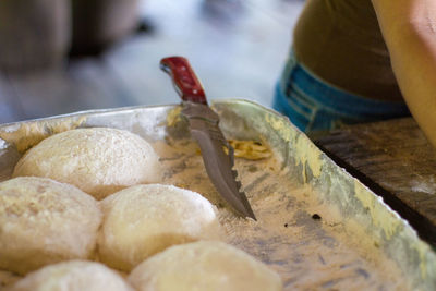 Close-up of person preparing food