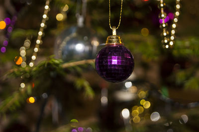 Close-up of illuminated christmas tree at night