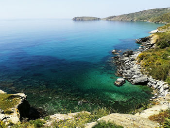 High angle view of rocks by sea