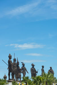 Low angle view of statue against sky