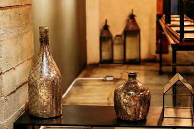 Close-up of old glass bottles on table