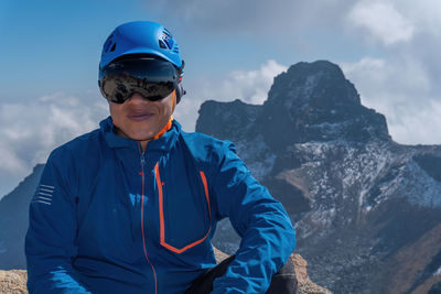 Portrait of man standing on mountain