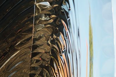 Close-up of camera against sky