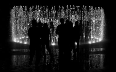 Illuminated fountain at night