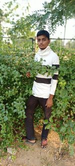 Portrait of young man standing outdoors