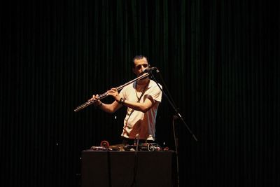 Man playing guitar at music concert